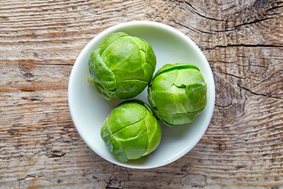 High angle view of green salad in bowl on table