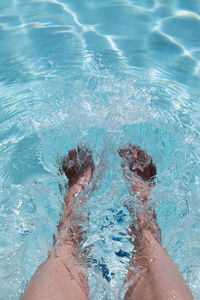 Low section of women in swimming pool