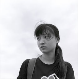 Close-up of girl against clear sky