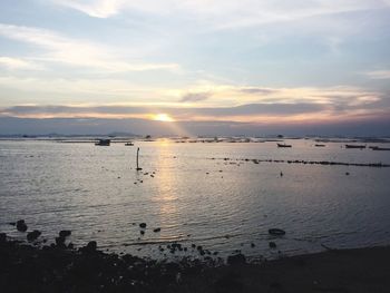 Scenic view of sea against cloudy sky