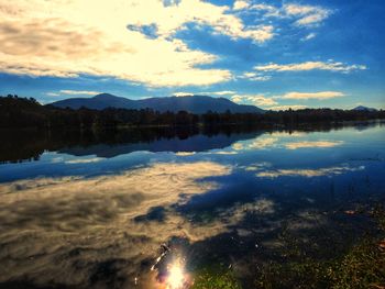 Scenic view of lake against sky during sunset