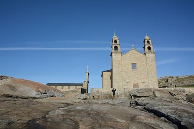 Low angle view of built structure against blue sky