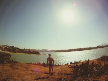 Full length of woman standing on beach