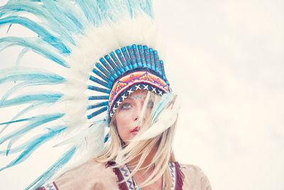 Young woman looking away while wearing headdress