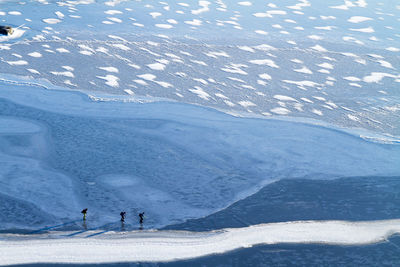 People ice-skating on frozen water