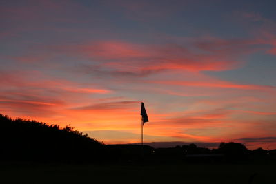 Silhouette of airplane at sunset