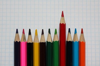 Close-up of colored pencils against white background