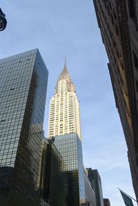 Low angle view of modern buildings against sky