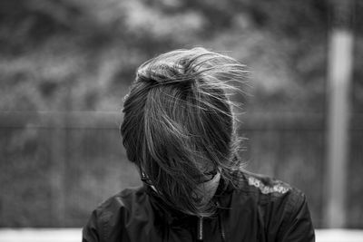 Close-up of woman with tousled hair