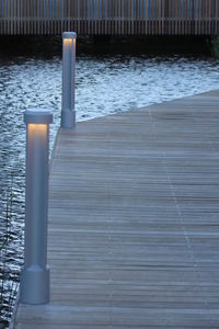 Wet wooden posts in water