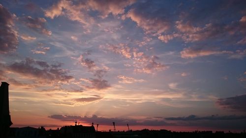 Scenic view of silhouette trees against sky at sunset