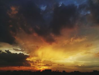 Scenic view of dramatic sky during sunset