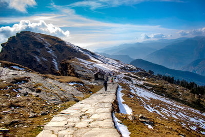 Scenic view of snowcapped mountains against sky