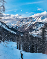 Scenic view of snowcapped mountains against sky