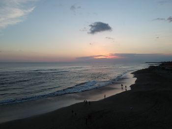 Scenic view of beach against sky during sunset