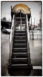 Man on escalator against sky