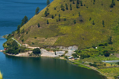 High angle view of lake amidst buildings