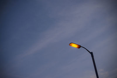Low angle view of street light against sky