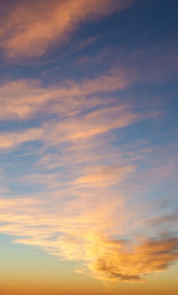 Low angle view of cloudy sky during sunset