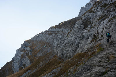 Low angle view of rock formations against sky