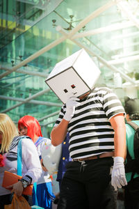 Rear view of people holding hands