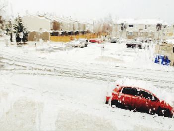 Close-up of car on snow covered road