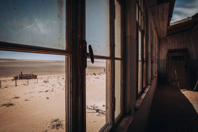 Scenic view of landscape seen through window