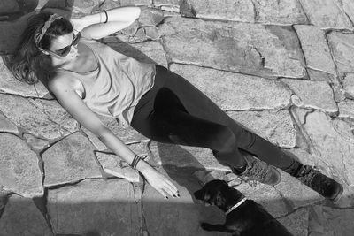 High angle view of young woman with dog