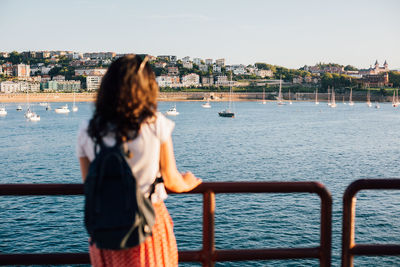 Rear view of woman looking at sea