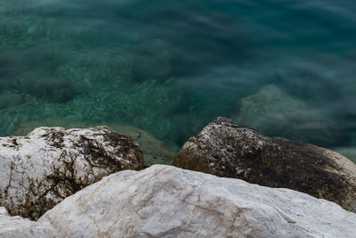 High angle view of rocks in sea