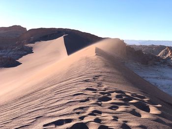 Scenic view of desert against clear sky