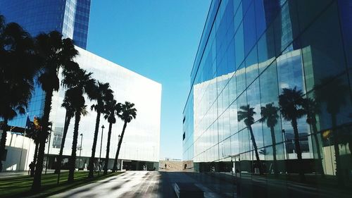 Low angle view of buildings against blue sky