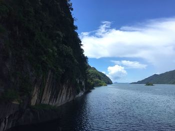 Scenic view of tree mountains against sky