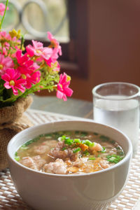 Close-up of soup in bowl on mat