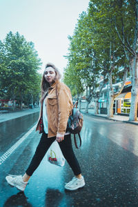 Portrait of young woman in city