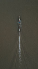 Aerial view of boat sailing at river