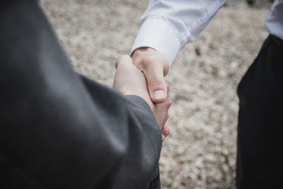 Cropped image of businessman doing handshake