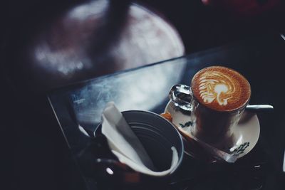 Close-up of coffee cup on table