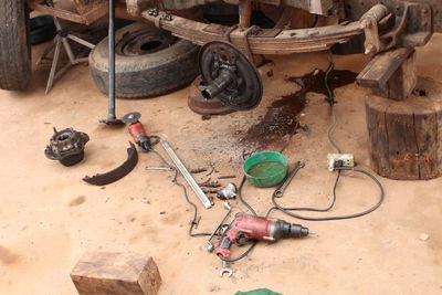 High angle view of work tools on land in garage