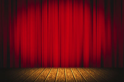 Red umbrella on hardwood floor