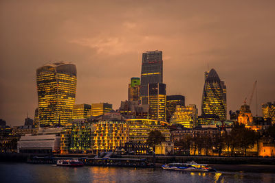 River with illuminated buildings in distance