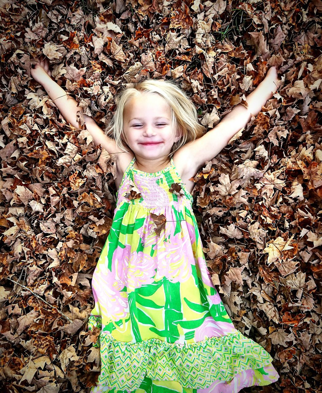 PORTRAIT OF SMILING GIRL WITH ARMS RAISED