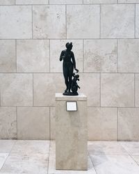 Statue against wall