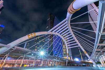 Low angle view of illuminated building against sky at night