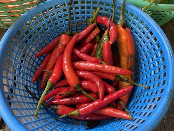 Close-up of red chili peppers in basket