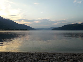 Scenic view of lake against sky during sunset