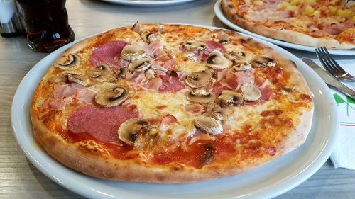 High angle view of pizza in plate on table