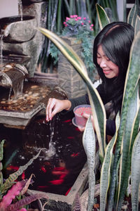Woman holding food in water