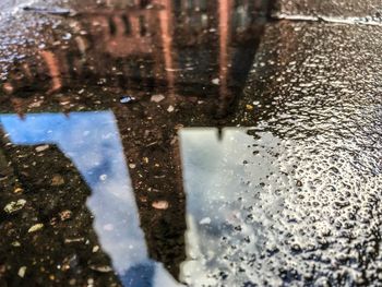 Reflection of road in puddle