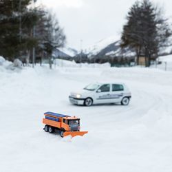 Close-up of car on snow covered road